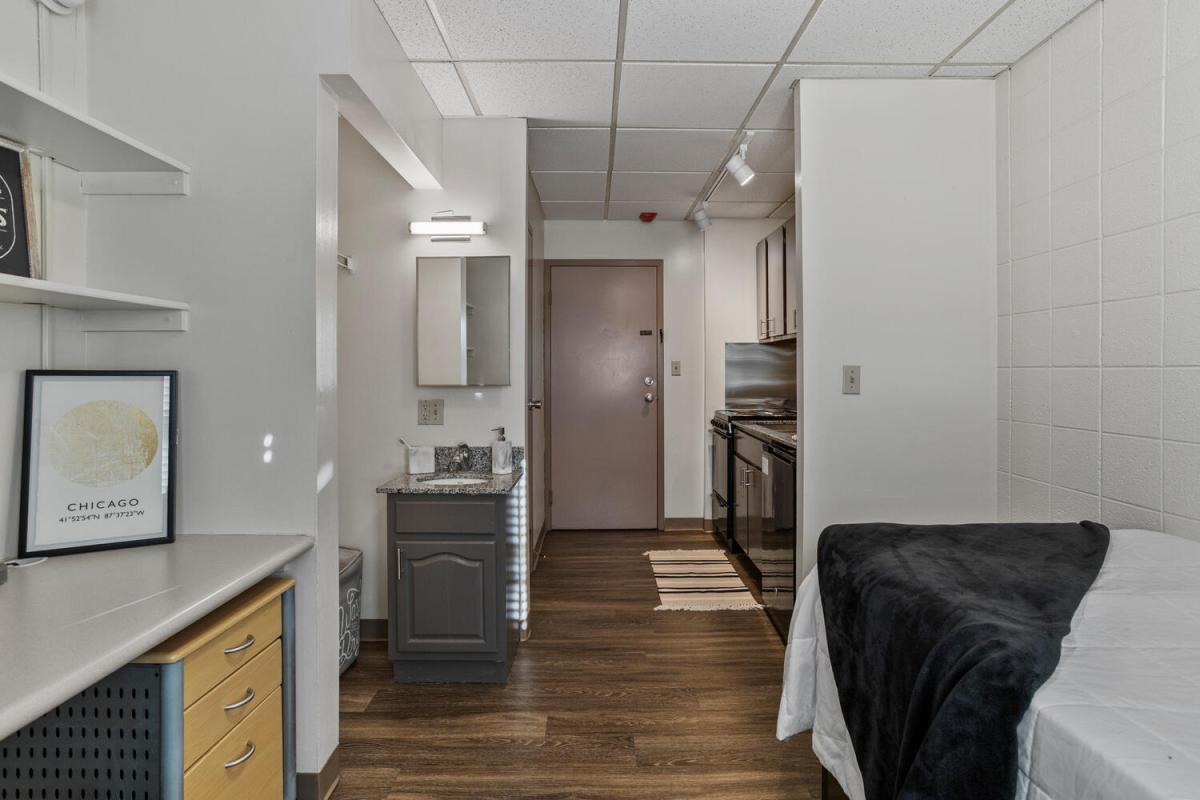 Bed, Desk, Sink, and Kitchen